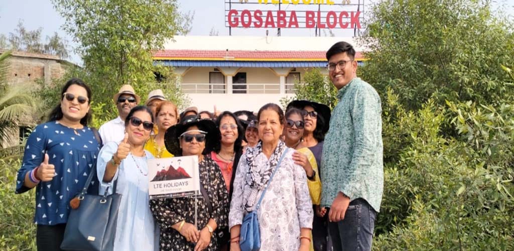 Guests, including those from the 'LTE Holidays Company, tour the Sundarbans by Biswanath Naskar, the owner of Sundarban Packages.